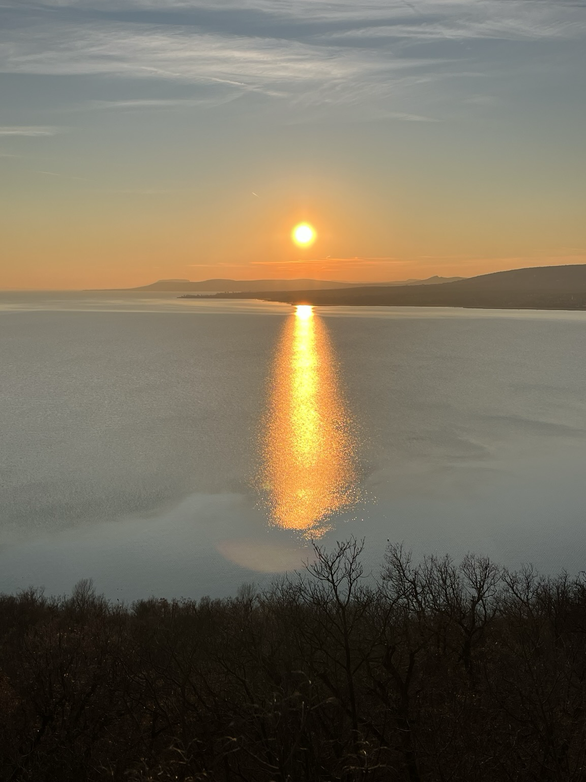 Setting sun and reflections on the water