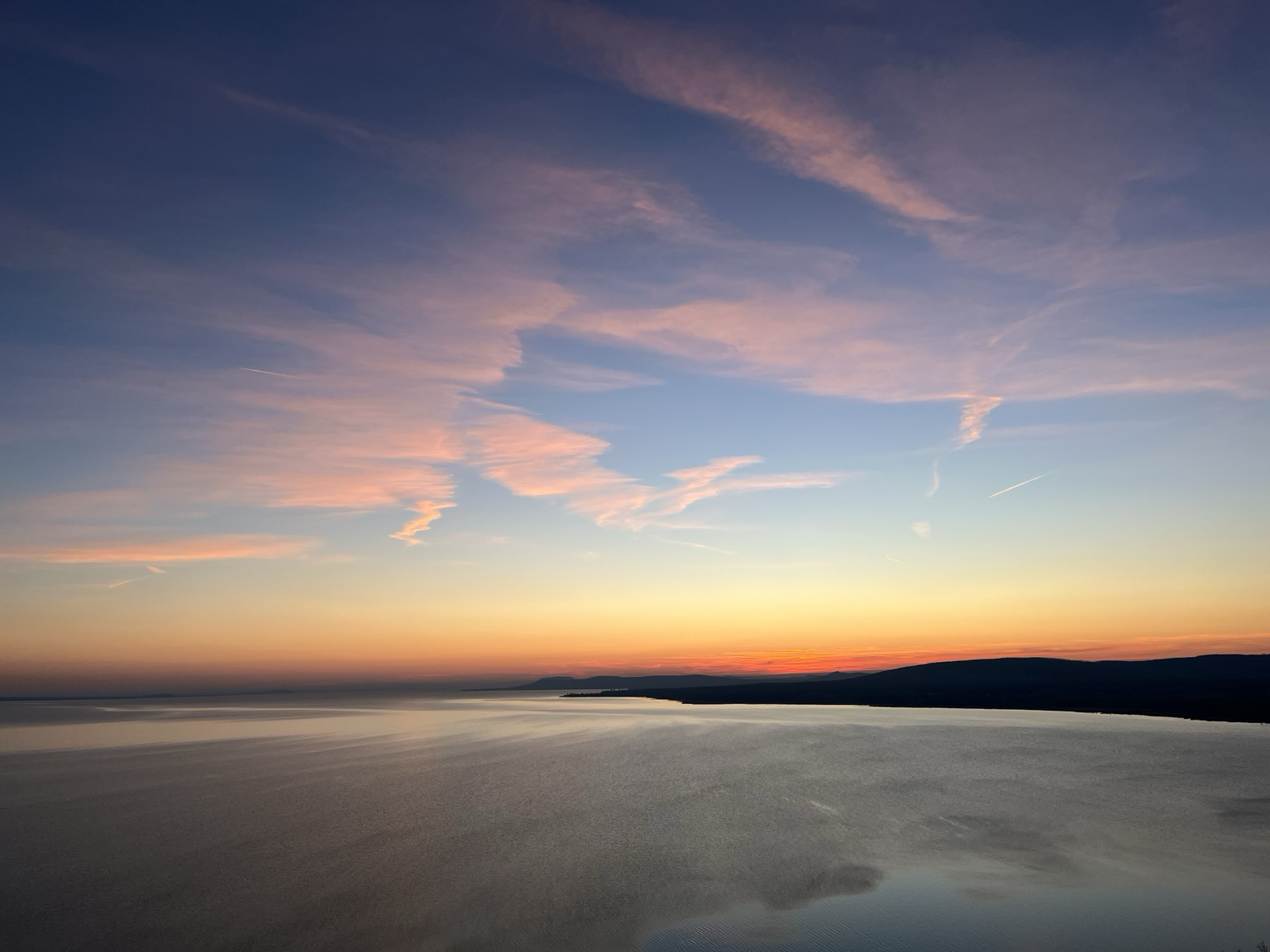 Sky right after sunset with scattered pink clouds