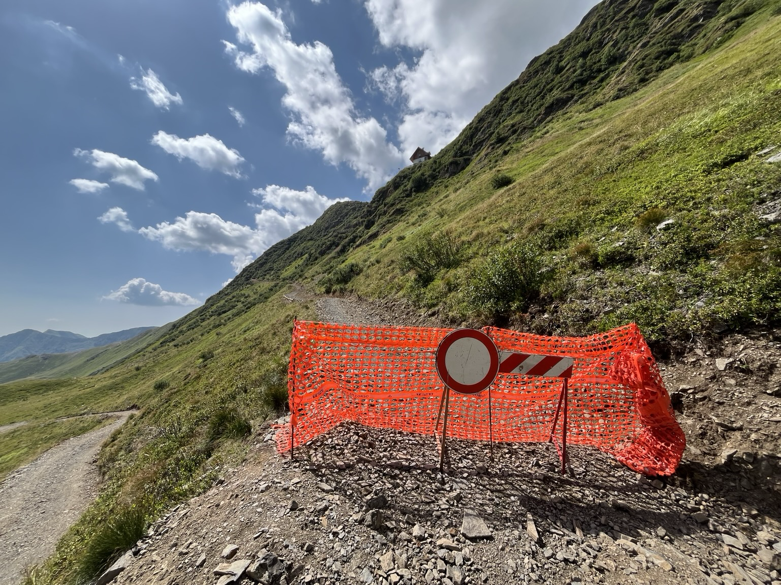 Road closed sign and barrier on the first climb